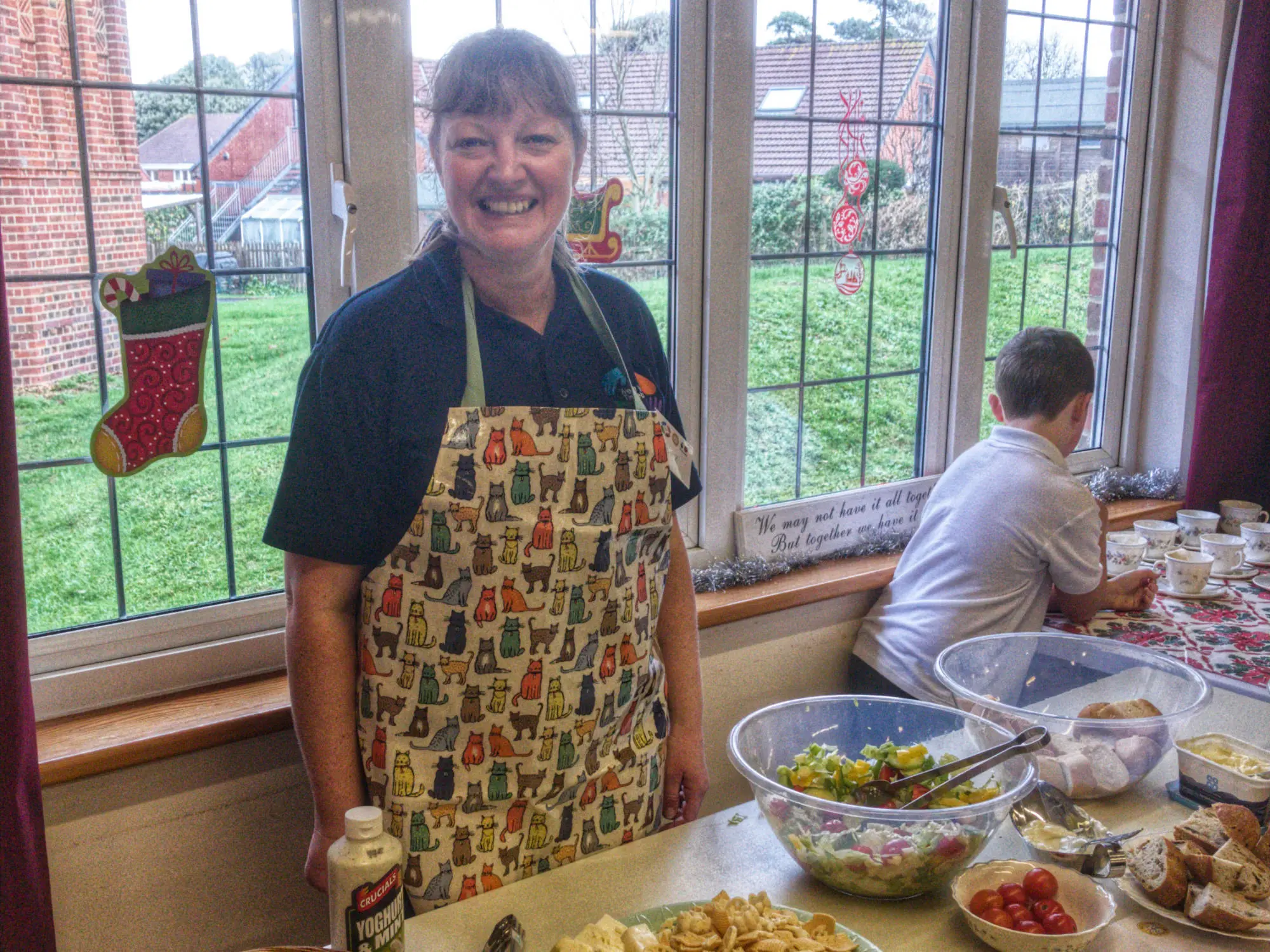 Inez serves food for the community at Meet and Eat