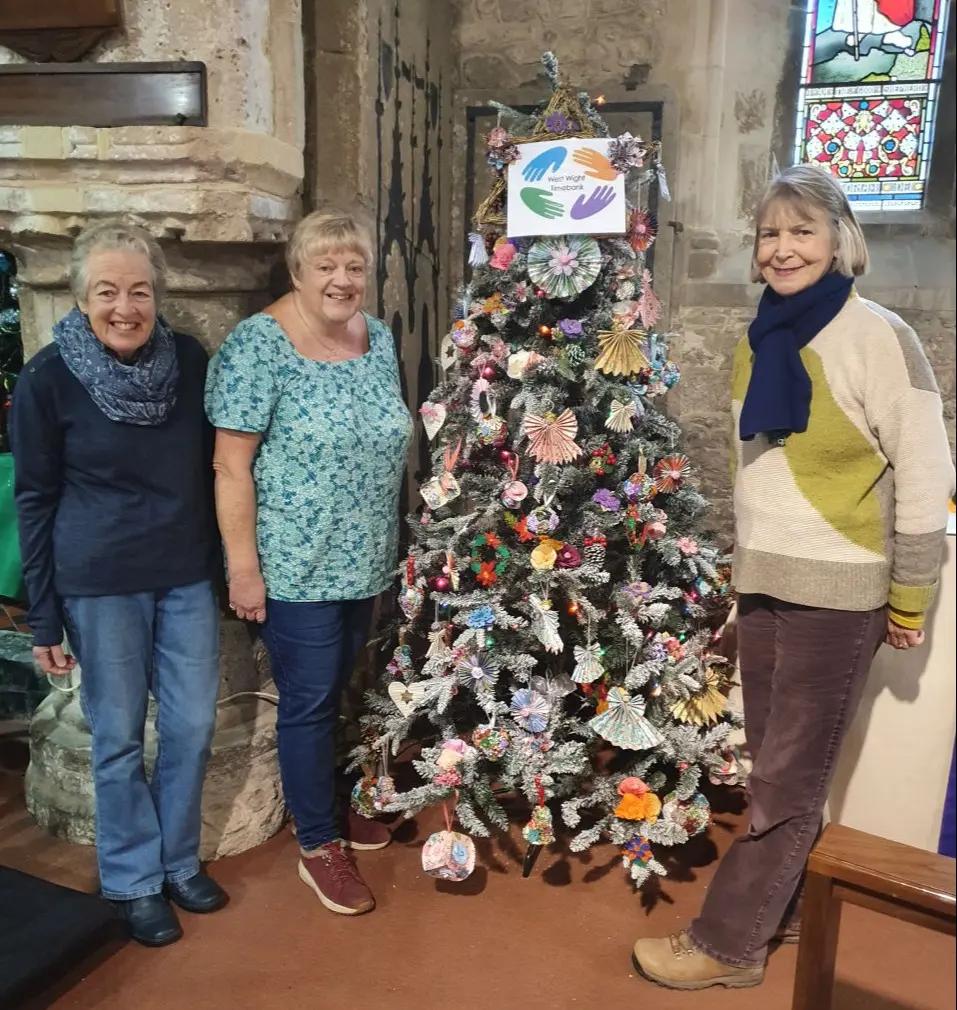 Timebank members with the 2022 Christmas tree at All Saints Church